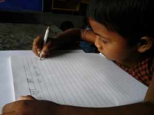 a-child-writing-in-class-one